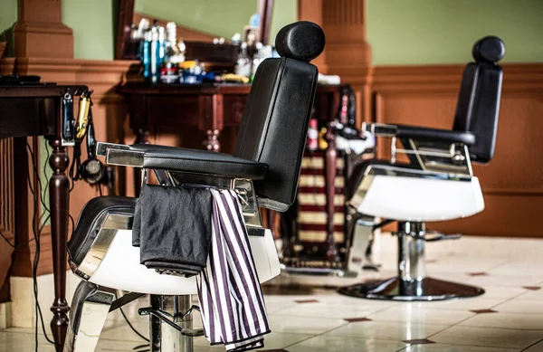 depositphotos_418037762-stock-photo-professional-hairstylist-in-barbershop-interior